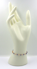 Load image into Gallery viewer, 18k rose gold thin 6.1" bracelet with 3mm faceted tanzanite and 1.5mm sphere