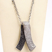 Charger l'image dans la galerie, 18k white gold necklace hug bow pendant white black diamonds, diamond cut chain.