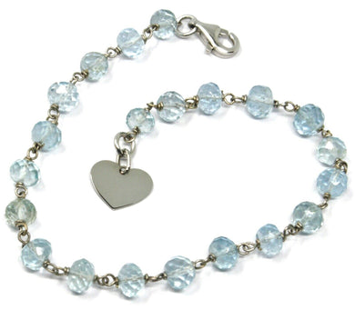 18k white gold bracelet, oval faceted aquamarine, flat heart pendant.