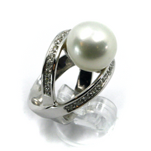 Load image into Gallery viewer, 18k white gold doble crossed ring, big australian 12mm pearl and diamonds frame.