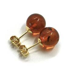 Load image into Gallery viewer, solid 18k yellow gold lobe earrings, orange amber 10mm spheres butterfly closure.