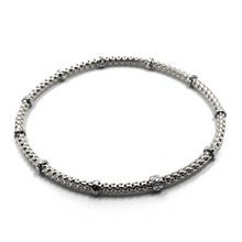 Load image into Gallery viewer, 18k white gold elastic bracelet, alternate 3mm basket popcorn tube, worked discs.