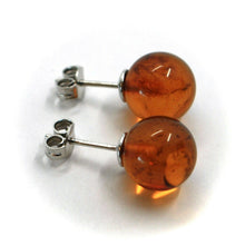 Load image into Gallery viewer, solid 18k white gold lobe earrings, orange amber 11mm spheres butterfly closure.