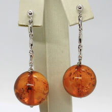 Load image into Gallery viewer, 18k white gold pendant earrings, big orange amber 16 mm spheres, 1.8 inches.