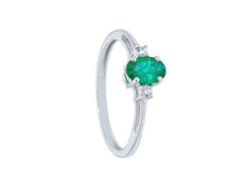 Load image into Gallery viewer, solid 18k white gold ring with oval cut emerald 0.4 carats and two diamonds.