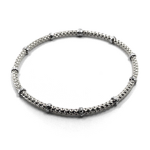 Load image into Gallery viewer, 18k white gold elastic bracelet, alternate 3mm basket popcorn tube, worked discs.
