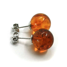 Load image into Gallery viewer, solid 18k white gold lobe earrings orange amber 12.5mm spheres butterfly closure.