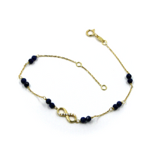 Cargar imagen en el visor de la galería, Pulsera de oro amarillo de 18k de 7,5&quot;, lapislázuli facetado azul de 3 mm, infinito central
