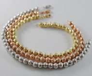 TRES PULSERAS DE ORO BLANCO ROSA Y AMARILLO DE 18 QUILATES CON BOLAS HECHAS EN ITALIA 