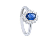 solid 18k white gold flower ring oval cut sapphire 0.98 carats, diamonds frame.