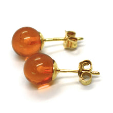 Load image into Gallery viewer, solid 18k yellow gold lobe earrings, orange amber 8 mm spheres butterfly closure.
