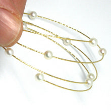 Load image into Gallery viewer, 18k yellow gold magicwire bangle bracelet, elastic worked multi wires, pearls.
