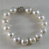 18k white gold bracelet with strand of white fw pearls 7.87 inches made in Italy.