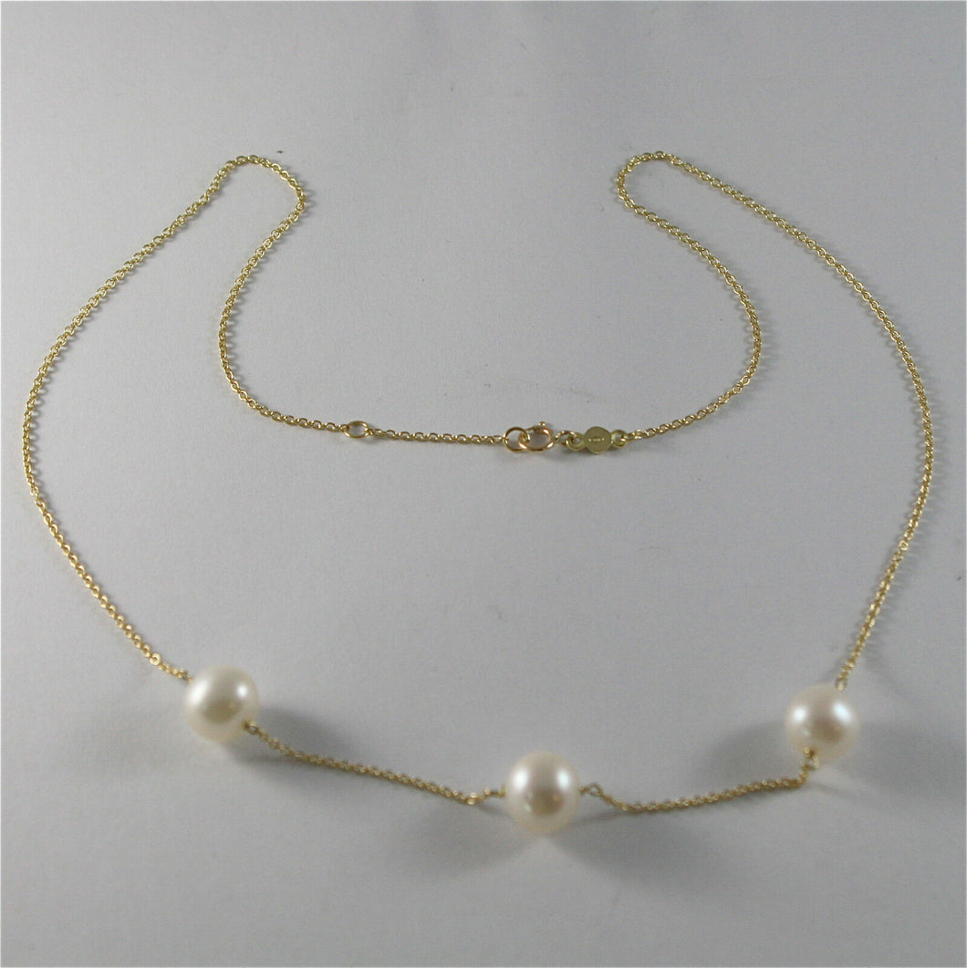 18k yellow gold necklace with round white freshwater pearls made in Italy.