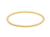 18k yellow gold elastic bracelet, alternate tubes ovals & discs width 3mm 0.12