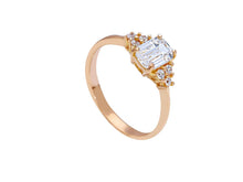 Load image into Gallery viewer, 18k rose gold solitaire trilogy engagement ring with 6x4mm emerald cut zirconia.
