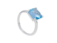 solid 18k white gold four prongs ring with big 10mm blue topaz, cushion cut.