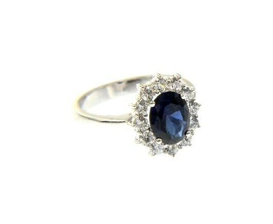 18k white gold flower ring big oval 9x7mm blue crystal cubic zirconia frame.
