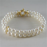 18k yellow gold bracelet with two strands white fw pearls 7.08 in made in Italy.