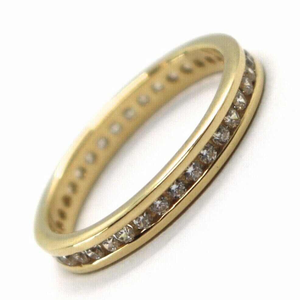 18K YELLOW GOLD ETERNITY BAND BINARY RING, WHITE CUBIC ZIRCONIA, THICKNESS 3 MM.