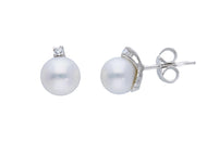 18k white gold earrings 7/7.5mm freshwater white round pearls, cubic zirconia.