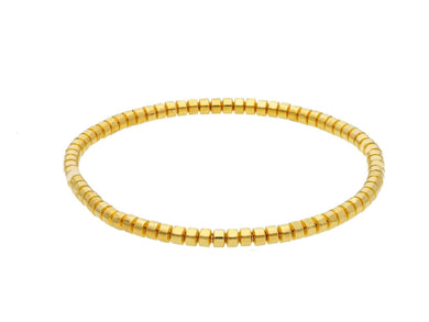 18k yellow gold elastic bracelet, small tubes discs diameter 3.2mm 0.13