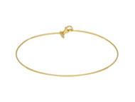 18k yellow gold bracelet, rigid, bangle, thin 1mm tube, smooth with lobster.