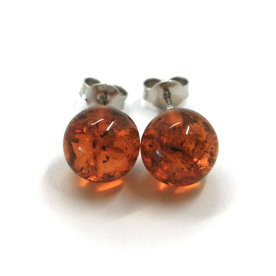 solid 18k white gold lobe earrings, orange amber 10mm spheres butterfly closure.