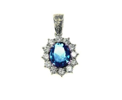 18k white gold flower pendant big oval blue 9x7mm crystal, cubic zirconia frame.