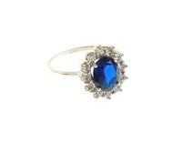 SOLID 18K WHITE GOLD FLOWER RING OVAL BLUE CRYSTAL AND CUBIC ZIRCONIA FRAME.
