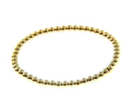 18k yellow gold bracelet, semirigid, elastic, 4 mm smooth balls spheres.