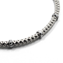 Load image into Gallery viewer, 18k white gold elastic bracelet, alternate 3mm basket popcorn tube, worked discs.
