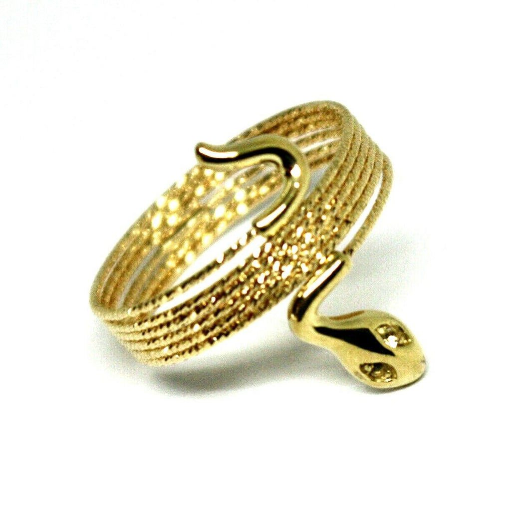 18k yellow gold magicwire multi wires ring, elastic worked snake, white topaz.