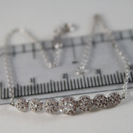 18k white gold bracelet 7.50, mini tennis flower zirconia 1.05 ct.