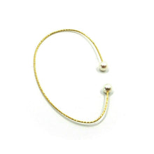 Load image into Gallery viewer, 18k yellow gold magicwire mono single earring elastic worked pearls without hole.
