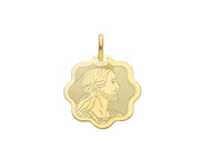 18K YELLOW GOLD FLOWER MEDAL WITH JESUS MADE IN ITALY VERY BRIGHT.