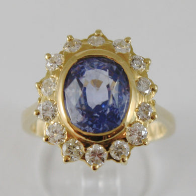 18k yellow gold band flower ring with diamonds and blue topaz, made in Italy.