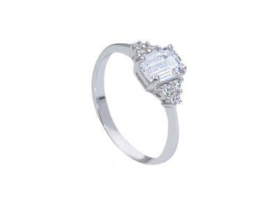 18k white gold solitaire trilogy engagement ring with 6x4mm emerald cut zirconia.