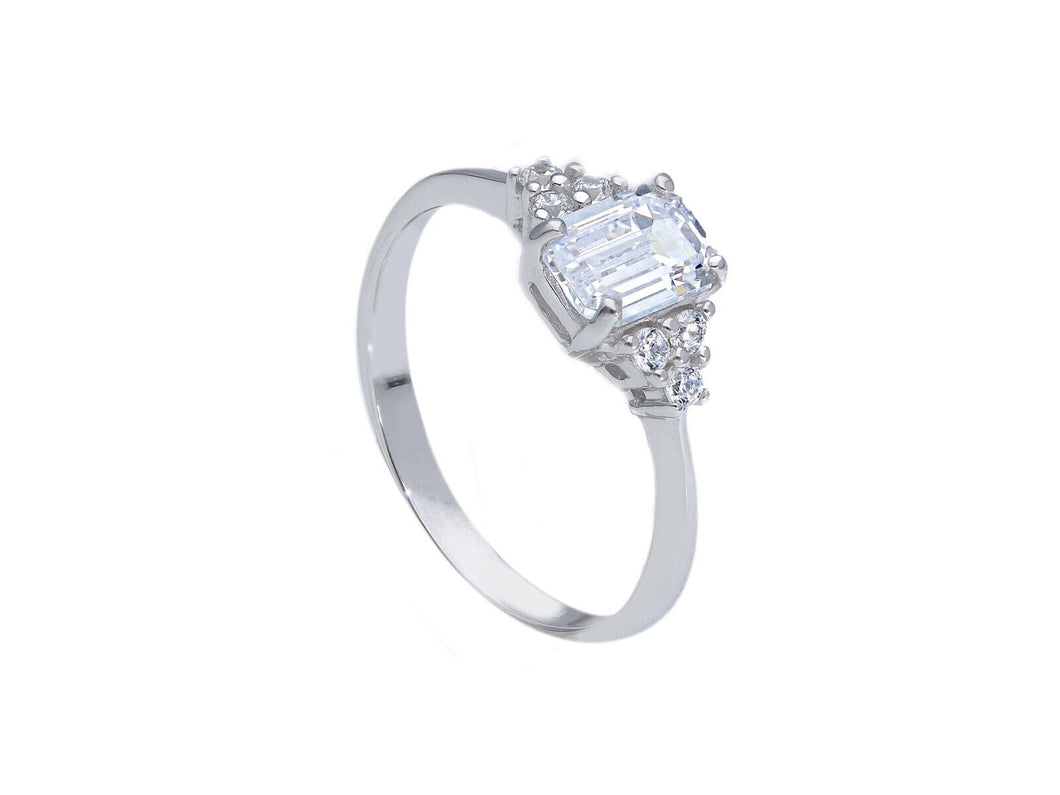 18k white gold solitaire trilogy engagement ring with 6x4mm emerald cut zirconia.