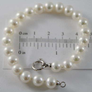 18k white gold bracelet 7.5 inches with white 8 mm fw pearls, made in Italy.