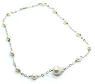 18k white gold necklace oval baroque central pearl, round pearls, rhombus chain.