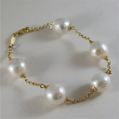 18k yellow gold bracelet with very shiny baroque pearls 8.25 in made in Italy.