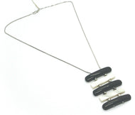 18k white gold lariat necklace black white onyx and mother of pearl bar pendant.