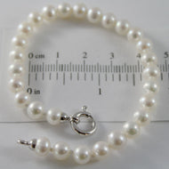 18k white gold bracelet 7.5 inches with white 6 mm fw pearls, made in Italy.