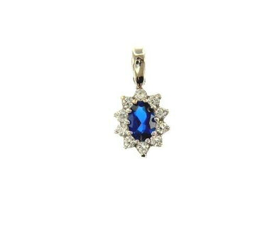 18k white gold flower pendant oval blue crystal and cubic zirconia frame.