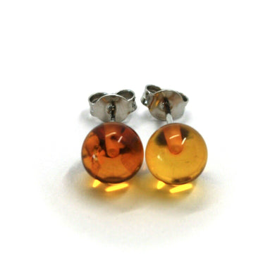 solid 18k white gold lobe earrings, orange amber 8 mm spheres butterfly closure.