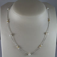 SOLID 18K WHITE GOLD NECKLACE WITH FRESHWATER WHITE PEARL AND YELLOW GOLD BALLS.